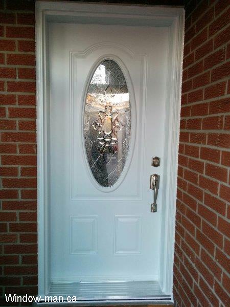 Entrance front door. Single entry steel insulated white. Oval stained glass. Oval Peterborough. Leaded Glass with zinc caming. Professional installation by a renovation contractor